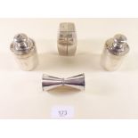 A novelty silver plated salt and pepper in form of a diabolo and two other plated cruet sets