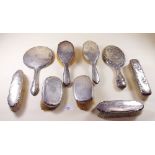 Seven silver backed brushes and two mirrors