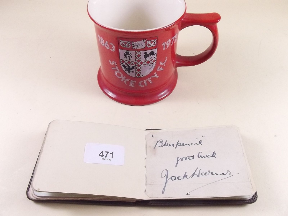 An autograph book with a variety of signatures including Jack Warner, the team of Stoke City