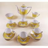 A Czechoslovakian yellow Art Deco style coffee set comprising six cups and saucers, milk jug,