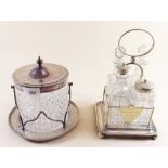 A silver plated and cut glass biscuit jar and a similar cruet stand