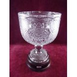 A largeTyrone Crystal centre piece or punch bowl on pedestal foot and turned wood base 38cm high (