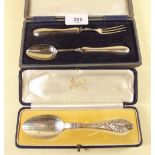 A silver christening spoon and fork, cased - Chester 1923, and a silver Christening spoon