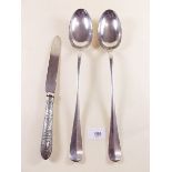 A pair of silver plated basting spoons and a cake knife