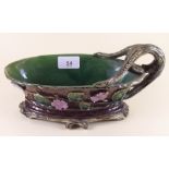 A Victorian Majolica sauce boat with applied floral and bough decoration - 23cm long