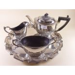 A silver plated tea set on a tray
