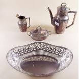 A three piece silver plated tea service and a large oval pierced dish