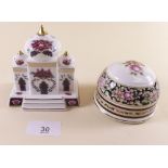 A Royal Worcester Prince Regent Pavilion paperweight and a Wedgwood floral paperweight