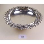 A sterling silver circular dish with laurel leaf rim, 330g, 20cm diameter