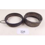 A Victorian silver inlaid bangle and another silver hinged bangle