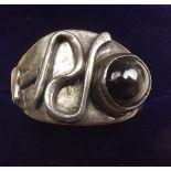 A silver gents ring by Niels Erik with initials 'RH' and stone, size W