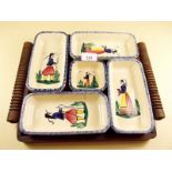 A Breton Quimper wooden mounted entree dish set