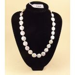 A button pearl necklace