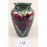 A small Moorcroft vase painted orchid with paper label - 9cm - chip to base