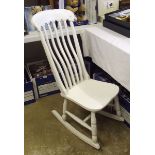 A white painted rocking chair