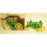 An Ertl John Deer tractor - boxed and another unboxed