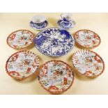 Two Japanese blue and white cups and saucers, five Kutani saucers and an Imari plate