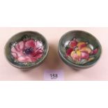 Two small Moorcroft dishes painted flowers on a green ground