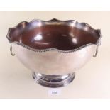 A silver plated on copper punch bowl with lion ring handles, 27cm dia.