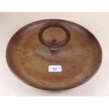 A carved wood circular nut or serving dish with central handle and acorn finial - probably by Alan