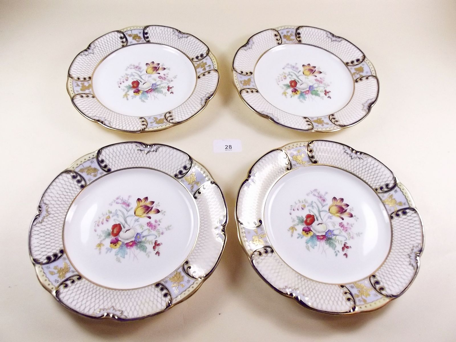 A set of four Hammersley floral painted plates