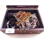 A box of vintage beads and costume jewellery
