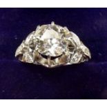 A fine platinum ring set large diamond (just over 2 carats) on diamond set shoulders, size N