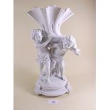 A large porcelain group two cherubs and a cornucopia - 33cm