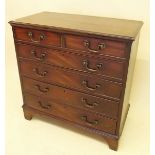 A small Georgian mahogany chest of two short and four long drawers (two of the drawers with internal