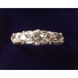 An 18 carat gold five stone diamond ring, size Q