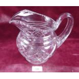 A large Victorian cut glass water jug - 18cm tall