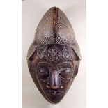 A large carved African tribal mask - 47cm