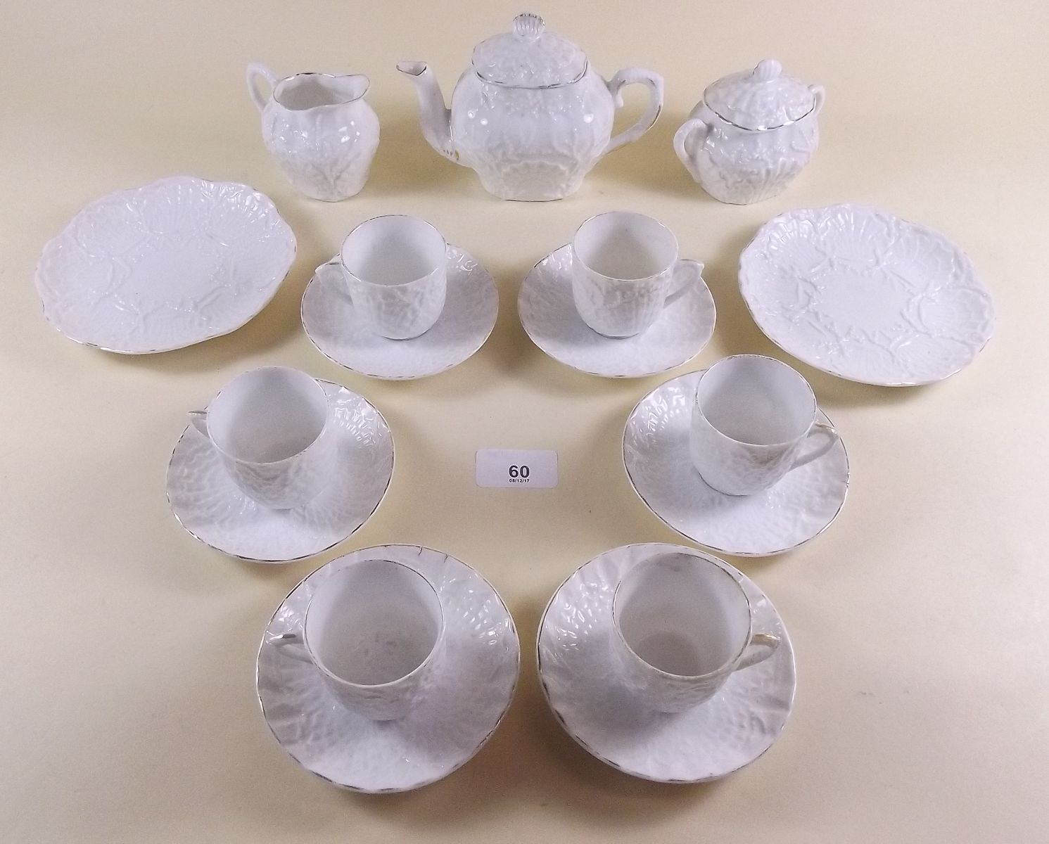A Victorian white porcelain dolls tea service comprising: 6 cups and saucers teapot, sugar bowl,