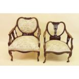 Two matching Victorian mahogany salon chairs with carved decoration