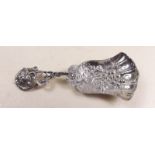 A Victorian silver caddy spoon decorated embossed vines to bowl and handle - Birmingham 1891 by