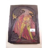 A carved low relief wooden plaque of a jester - 30 x 22cm