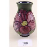 A Moorcroft vase painted clematis on a green and blue ground - 10cm