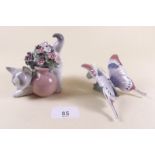 A Lladro butterfly 'A Moments Rest' and a cat 'Secret Spot' - both boxed