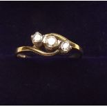 A 9 carat gold three stone crossover ring, size N