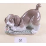 A Lladro figure of a dog - boxed 'A Sweet Smell'