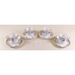 Three Edwardian Coalport floral printed coffee cans and saucers and five Kenmore floral coffee