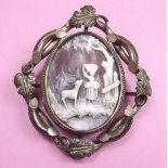 A Victorian pinchbeck scrollwork framed mourning brooch with pastoral scene carved cameo and