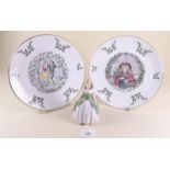 A pair of Royal Doulton Christmas plates and a figure Penny