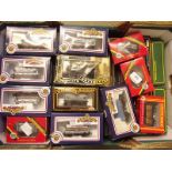 A quantity of OO gauge trucks - boxed, by Bachmann, Hornby, Maritime etc
