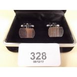 A pair of silver cufflinks - boxed