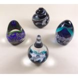 A group of four various paperweights including one Caithness