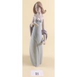 A Lladro figure of a standing girl - boxed 'Ingenue'