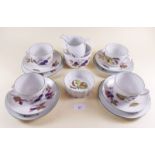 A group of Royal Worcester Evesham comprising: four cups and saucers, four tea plates, sugar etc