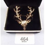 A vintage stags head brooch