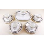 A Cauldon part tea service comprising four cups and saucers, four tea plates, sandwich plate and jug